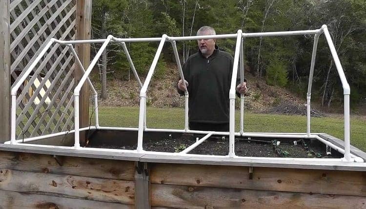 Man Making Mini Greenhouse
